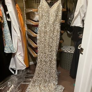 Evening gown by Jovani. Sequin champagne new and never worn!